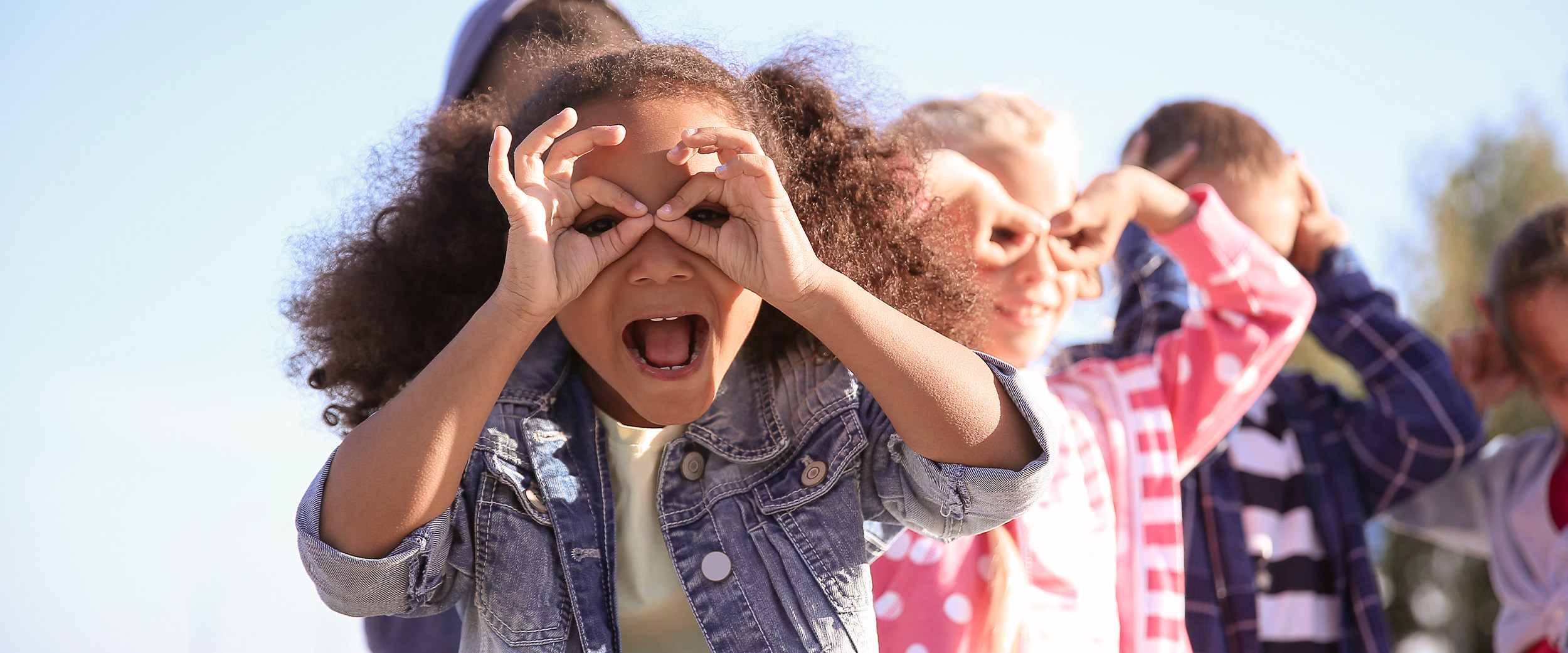 girl with binoculars for fingers