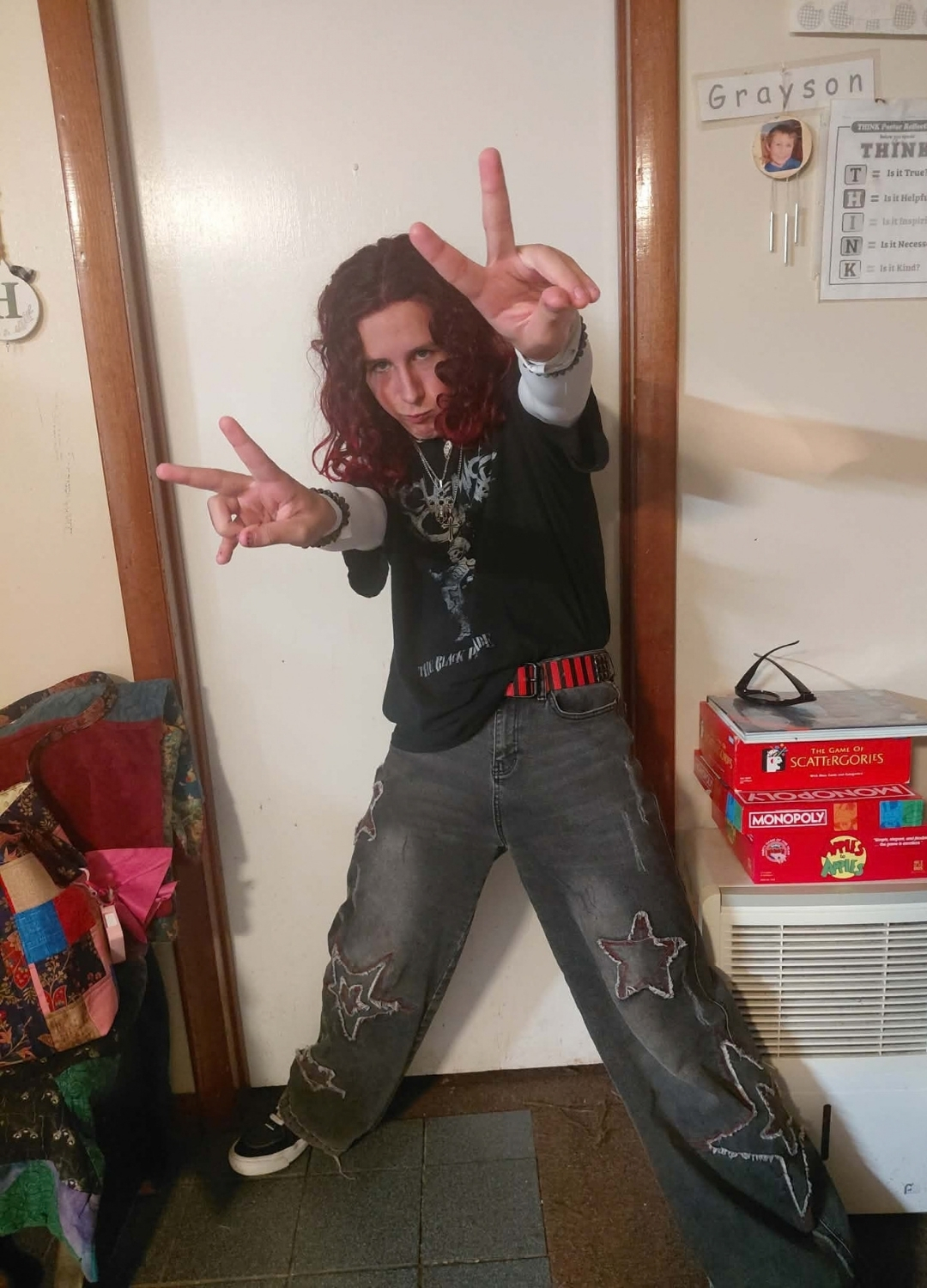 young man with peace sign fingers