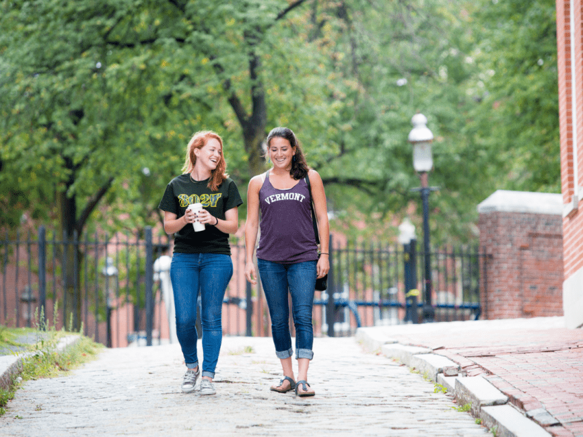 Two Vermont students walking on campus