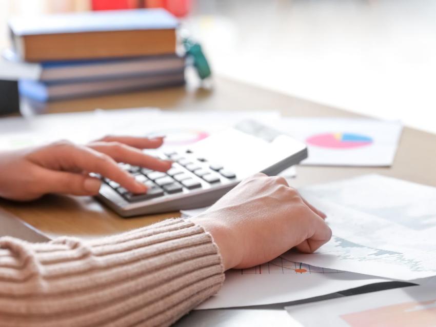 person with calculator