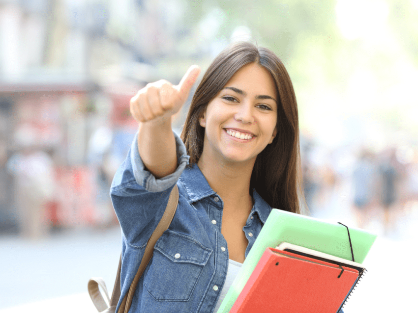 young woman giving a thumbs up