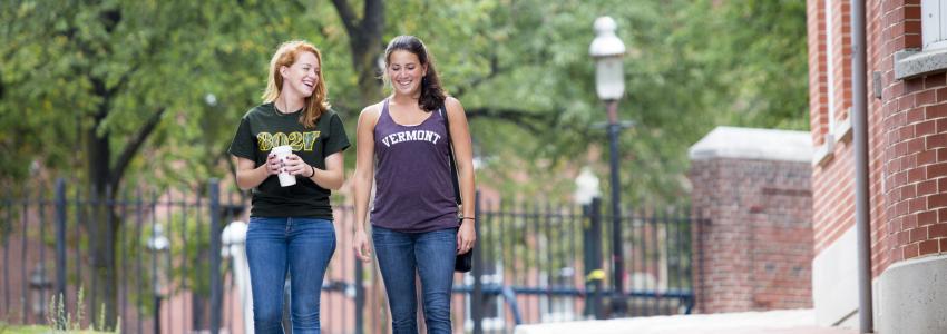 Two Vermont students walking on campus