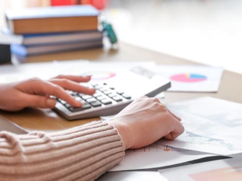 person with calculator