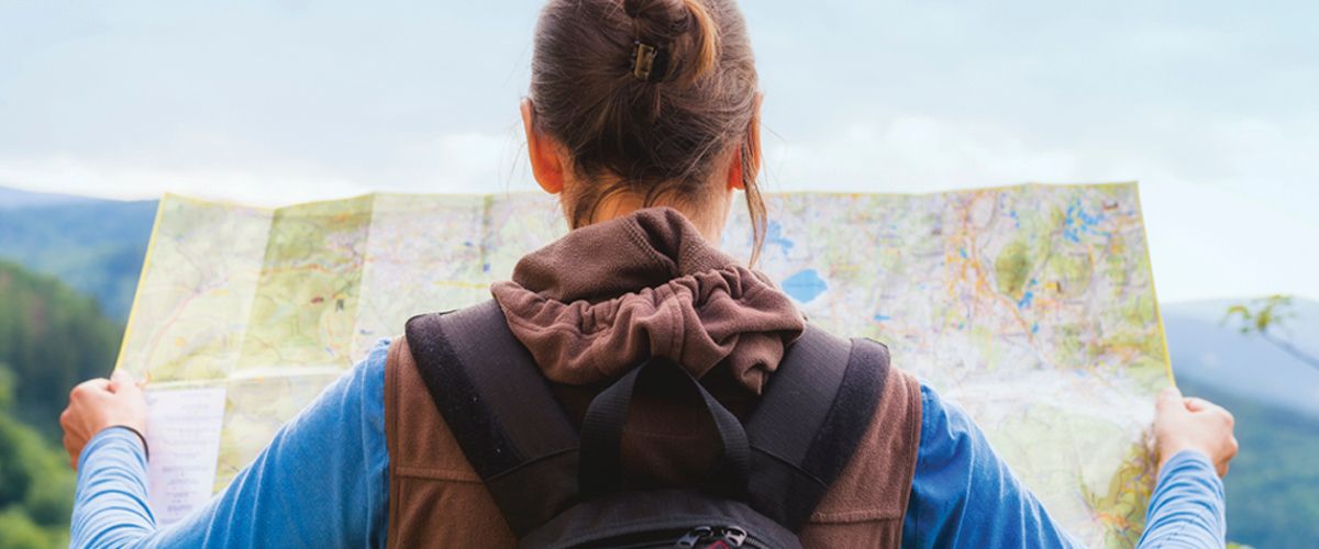 Student reading a map