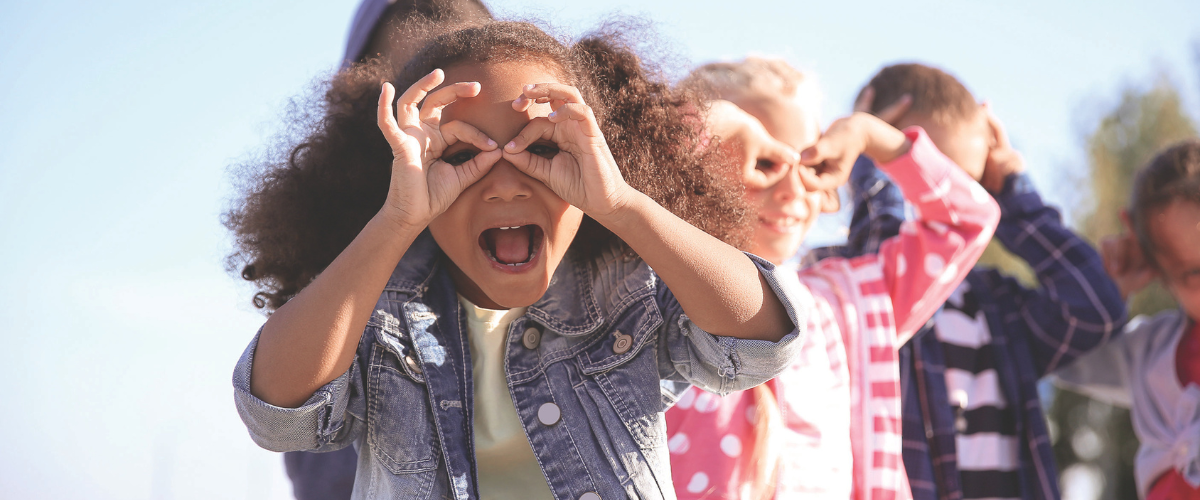 girl with binoculars for fingers